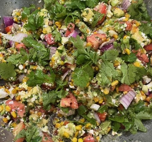 Garden Salad. Onions, Tomatoes, avocado, greens & Feta cheese.